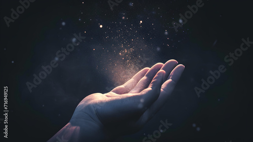 Praying hands with faith in religion and belief in God on blessing background. Power of hope or love and devotion. Magic powder floating on the magician hand.