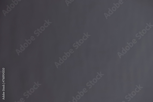 Blurred background in the form of a gray inhomogeneous surface photo