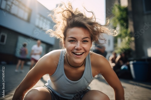 Portrait of an energetic girl in her 20s doing sit ups outdoors. With generative AI technology