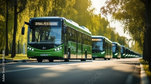 Green bus on the road in the park. Public transport concept.