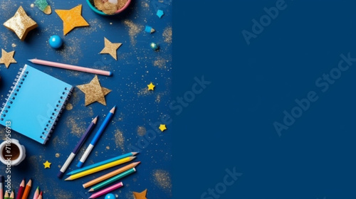 School supplies on a blue background. Back to school. Copy space. photo