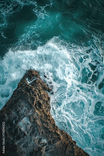 A captivating aerial shot showcasing the stunning beauty of the ocean. Perfect for travel brochures, website banners, and environmental campaigns