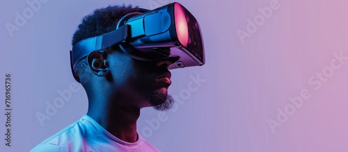An African American man in VR headset, representing the concept of virtual reality. © 2rogan