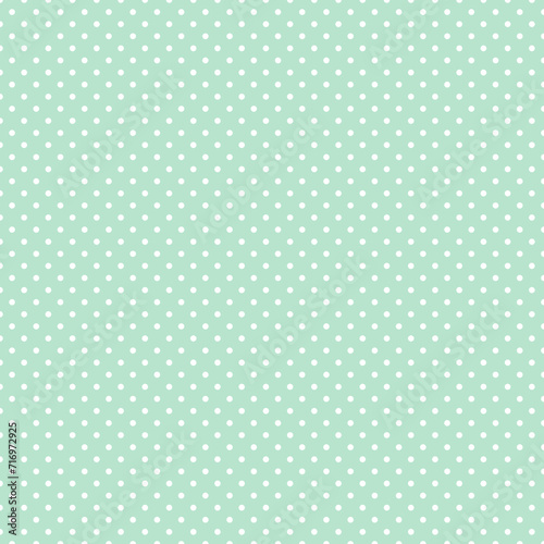 Green and white polka dot pattern, seamless texture background. Minimal fashionable design. Polka dots trendy background, tile. For fabric pattern, card, decor, wrapping paper