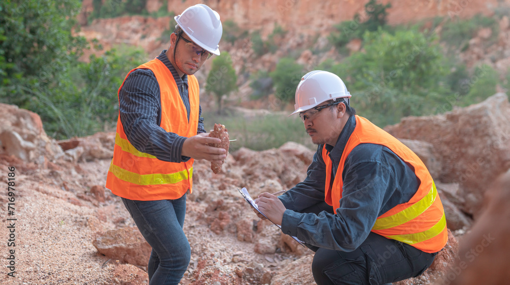 Geologist surveying mine,Explorers collect soil samples to look for minerals.