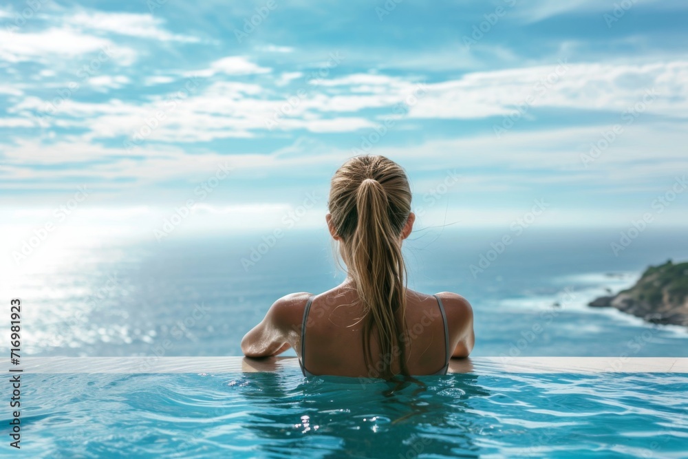 Beautiful Young Woman In Twosome By The Pool Overlooking The Ocean Beautiful Young Woman In Twosome By The Pool Overlooking The Ocean