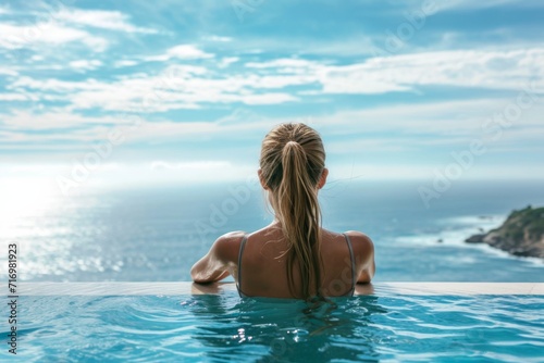 Beautiful Young Woman In Twosome By The Pool Overlooking The Ocean