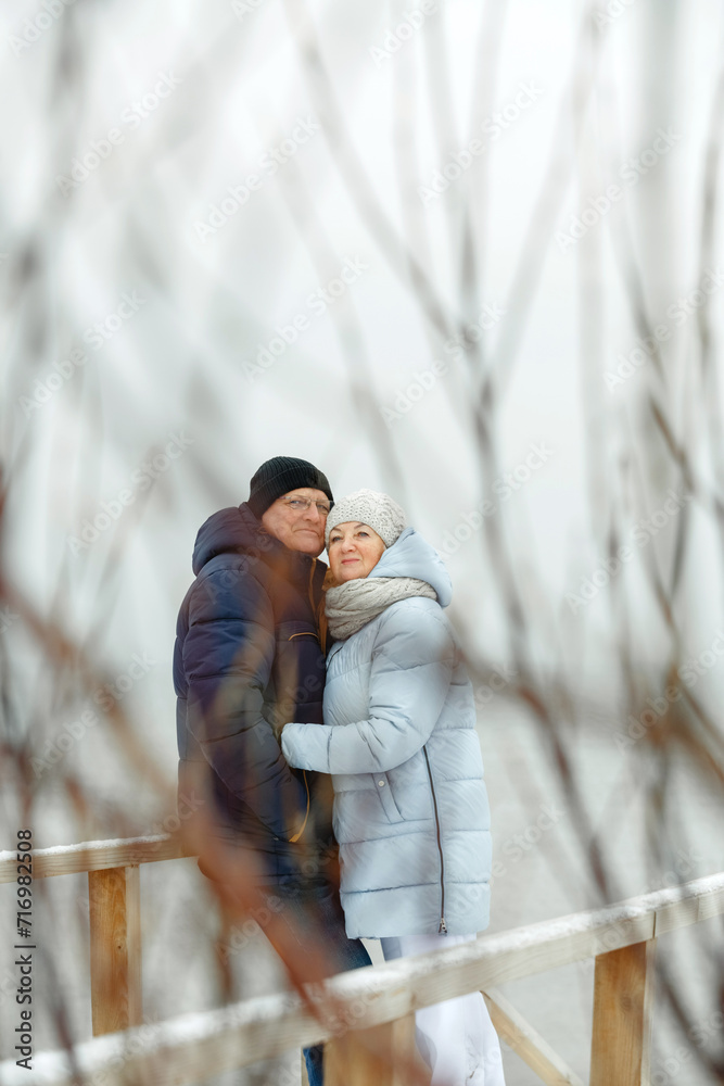 Portrait of a happy elderly couple by the sea. Portrait of a happy elderly couple by the sea.