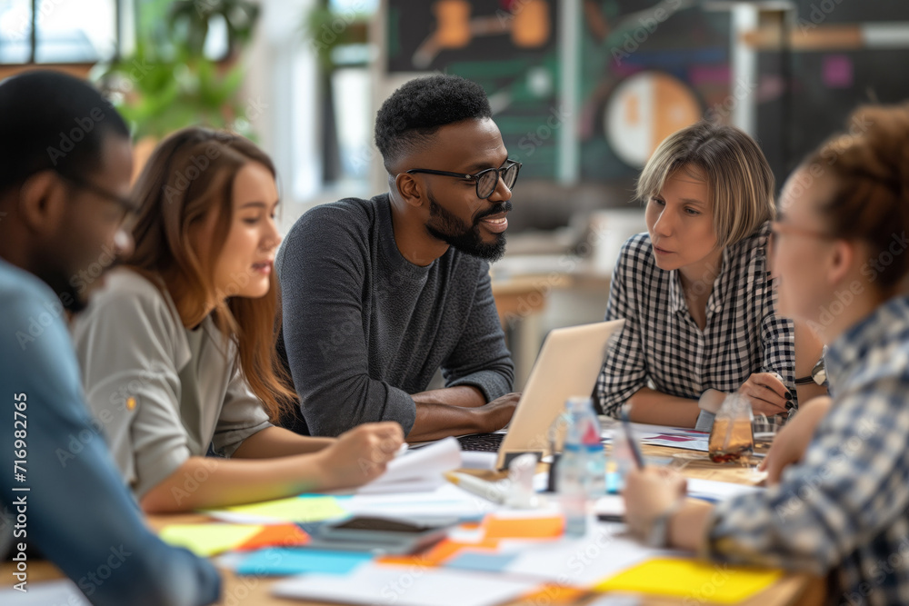 Diverse Team Collaborates, With Leader And Millennial Project Manager Leading The Way Diverse Team Collaborates, With Leader And Millennial Project Manager Leading The Way