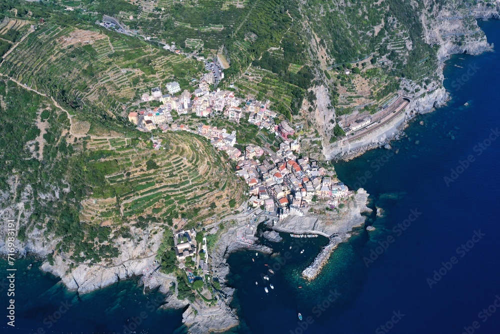 Aerial view of Riomaggiore: Riomaggiore in the province of La Spezia, Liguria. An ancient fishing village on the Riviera di Levante, it forms the easternmost and southernmost part of the Cinque Terre 