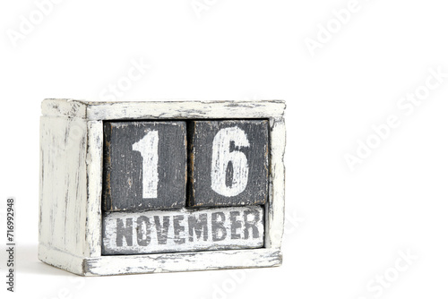 November 16 on wooden calendar, on white background.