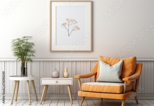 white photo frame on the wall with sofa chair and table