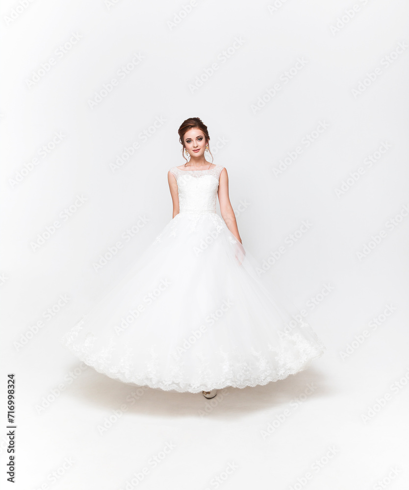 Young pretty caucasian bride in wedding dress