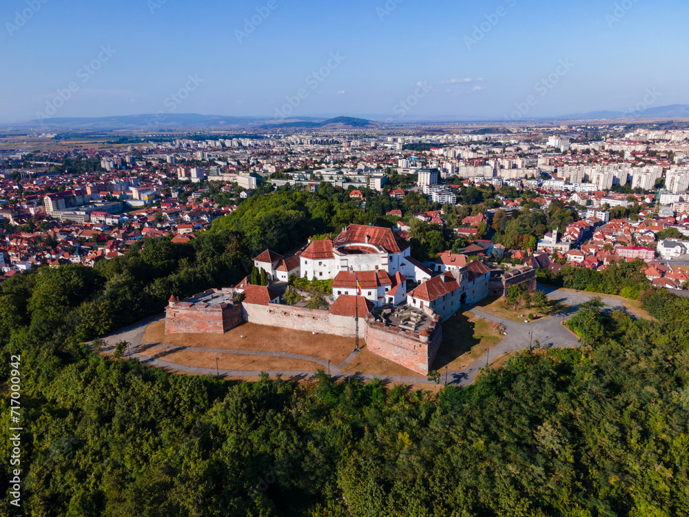 Landscape photography of the modern star shaped fortification in Brasov, Romania. Photography was taken from a drone at a higher altitude with camera level for a panoramic still of the bastion.