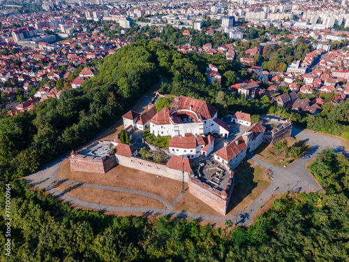 Landscape photography of the modern star shaped fortification in Brasov, Romania. Photography was taken from a drone at a higher altitude with camera lowered for a top view shot of the bastion.