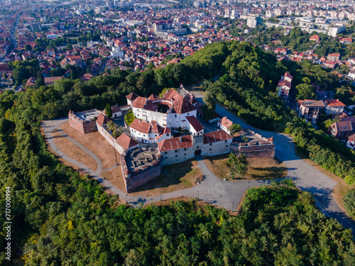 Landscape photography of the modern star shaped fortification in Brasov, Romania. Photography was taken from a drone at a higher altitude with camera lowered for a top view shot of the bastion.