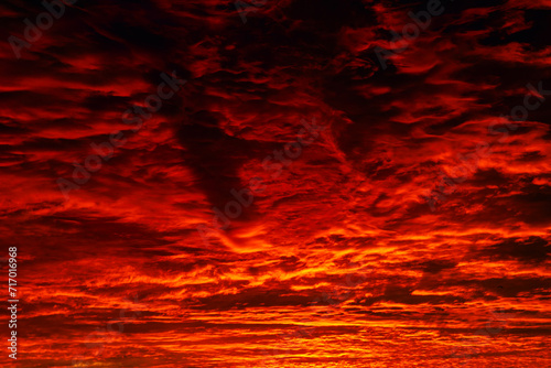 Red and orange clouds at sunrise or sunset.