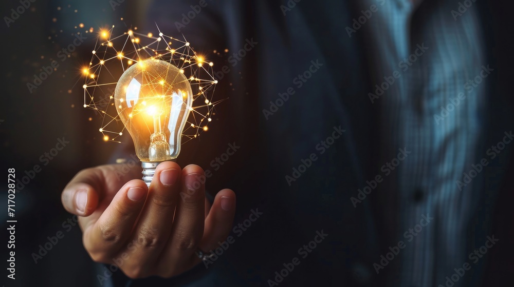 Businessman hand holding creative light bulb with industry network, analysis solution and development marketing network icons planning strategy, Modern business, Innovative of new ideas - obrazy, fototapety, plakaty 