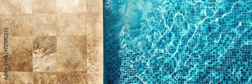 Close-up view of the pool from above. Blue mosaic background with copy space.