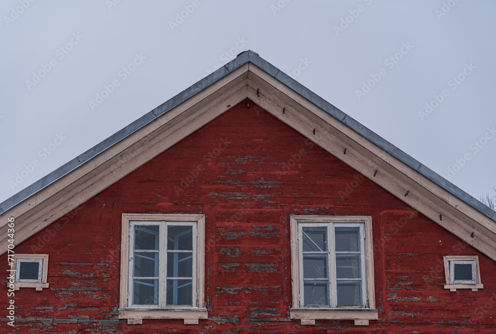 the roof ridge of a red old wooden house the roof ridge of a red old wooden house