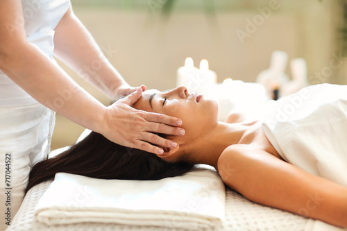 Asian woman resting during spa procedure