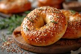 Tasty bagel with sesame and pumpkin seeds on light background,