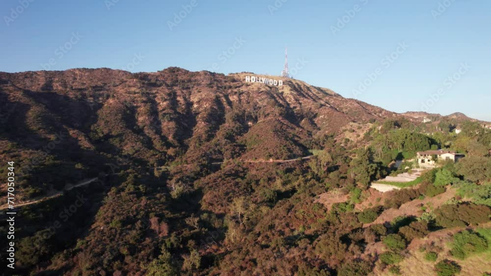 Establisching shot of Hollywood Sign in Los Angeles at sunset drone flight towards white letters