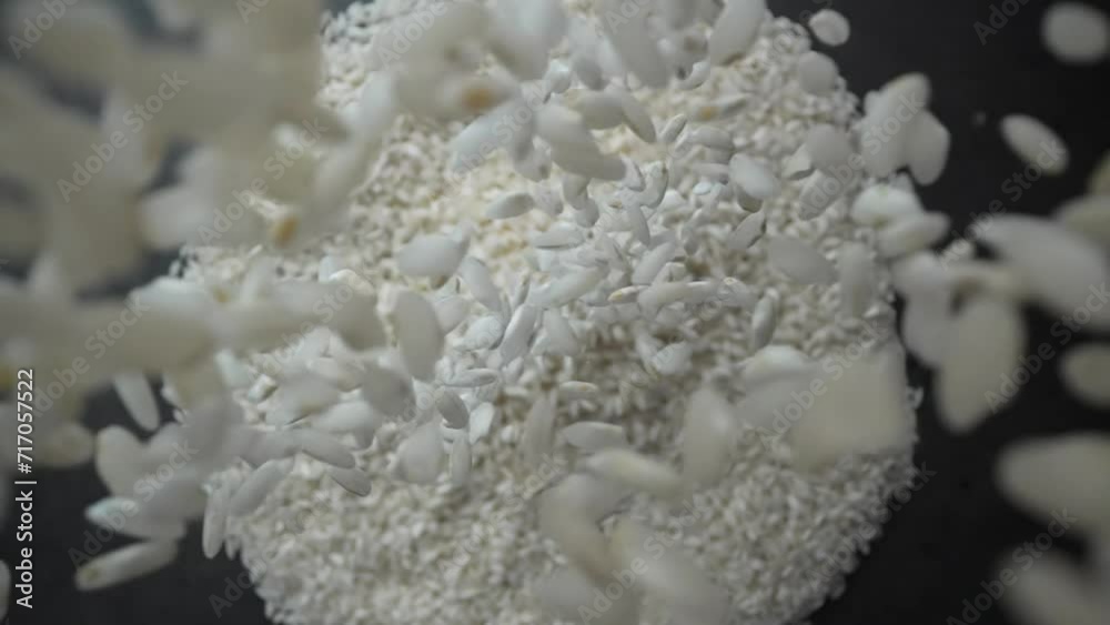 Rice dropped from hands in slow motion Rice dropped from hands in slow motion