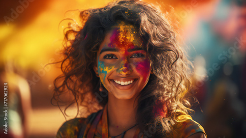 portrait of a woman with a colourful hair. portrait of a smiling happy young woman with holi color face, India festival