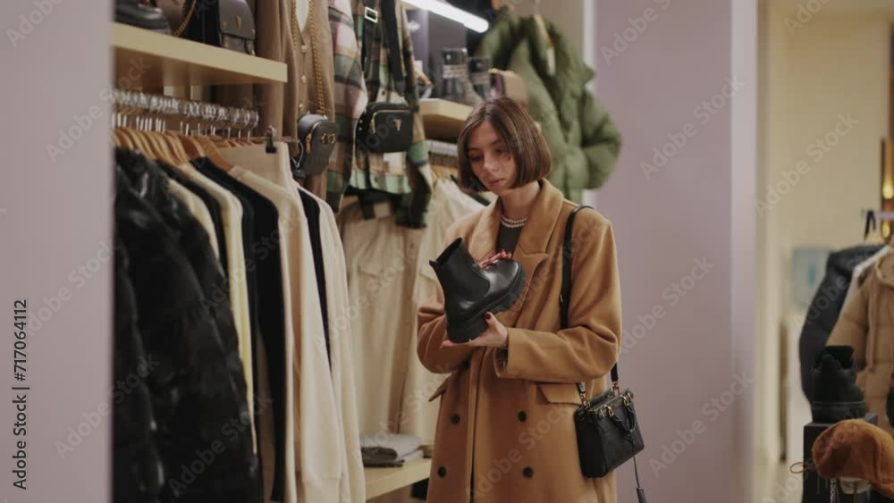 Weekend Shopping In Clothing Store, Young Woman Viewing Shoes And Dress In Trendy Shop