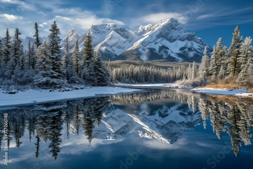 Almost nearly perfect reflection of the Rocky mountains in the Bow River. Near Canmore, Alberta Canada. Winter season is coming. Bear country. Beautiful landscape background concept