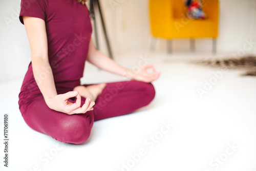 Slim woman meditating in Lotus pose