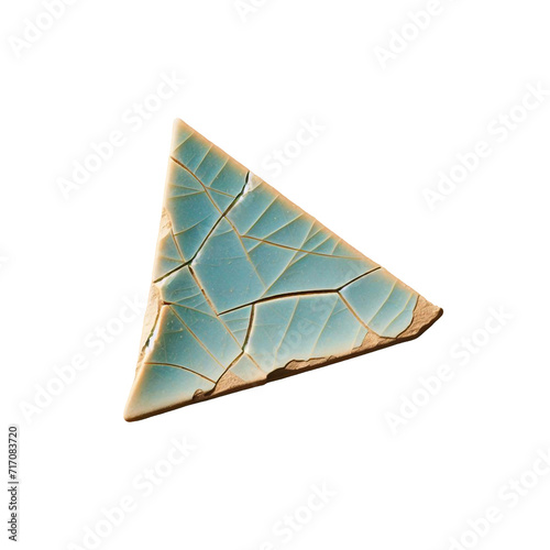 A broken, triangular shard piece of light blue pottery photo