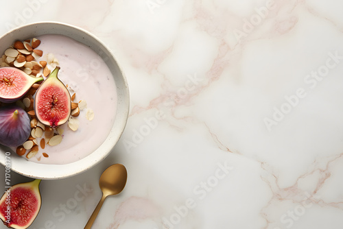 yogurt with figs and almond petals on a delicate pink background