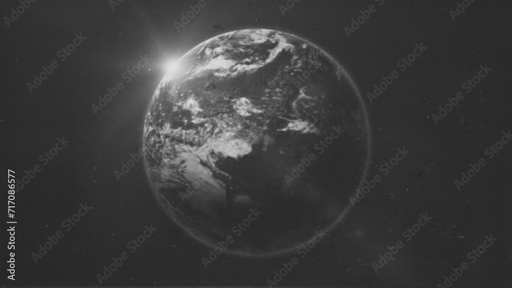 Vintage Old Textured Earth Planet Bg/ 4k animation of a vintage old tv screen of earth planet rotating with grain texture and floating camera effect