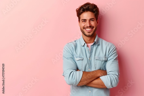 Photo of cheerful attractive handsome entrepreneur standing confidently with hands folded smiling beaming isolated over pastel color background