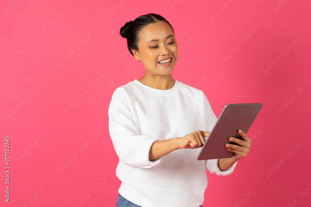 Modern Technologies. Portrait Of Young Smiling Asian Female Using Digital Tablet Modern Technologies. Portrait Of Young Smiling Asian Female Using Digital Tablet