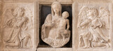 NAPLES, ITALY - APRIL 21, 2023: The marble relief of renaissance Madonna among the angels in the church Chiesa di Sant'Anna dei Lombardi by unknown artist.