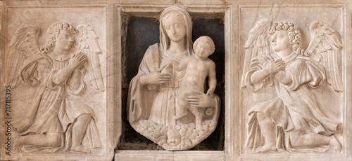 NAPLES, ITALY - APRIL 21, 2023: The marble relief of renaissance Madonna among the angels in the church Chiesa di Sant'Anna dei Lombardi by unknown artist. photo