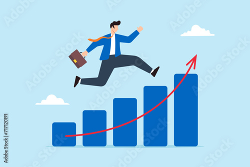 Businessman running up on growth chart
