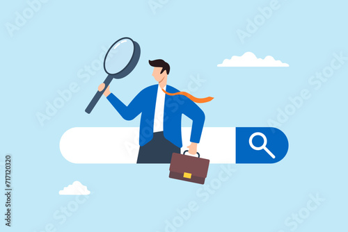 Businessman discover new website from search box using magnifying glass