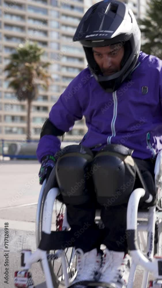disable athlete man in wheelchair perform tricks in skatepark disable athlete man in wheelchair perform tricks in skatepark