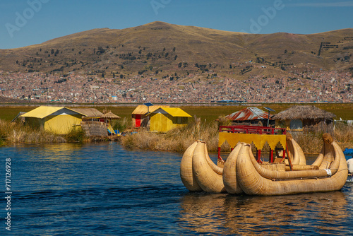 Tourist boats made of reed moored at Uros Islands, Lake Titicaca, Peru photo