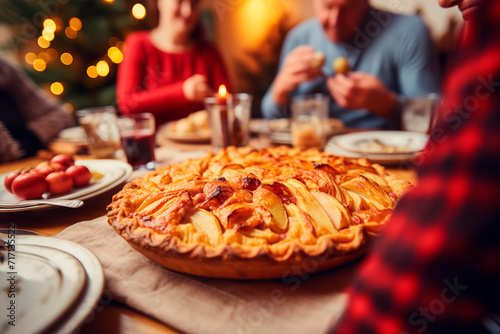 Homemade apple pie on a festive table  symbolizing tradition and family gathering.