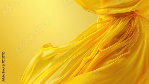 Golden satin fabric twisted into a knot on a bright background