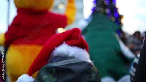 Red cap of Santa Claus on boy close-up in complex Losinyj Ostrov photo