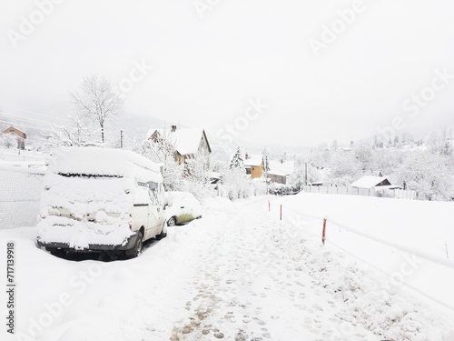 Winter landscape at Nydek village in Morsavskoslezske Beskydy, snowy cars
