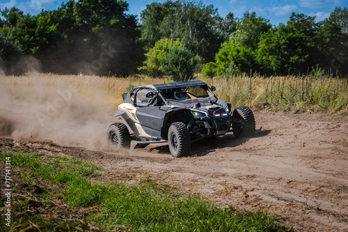 ATV and UTV riding in sandy dusty track. Amateur competitions. 4x4. © Anton Tolmachov