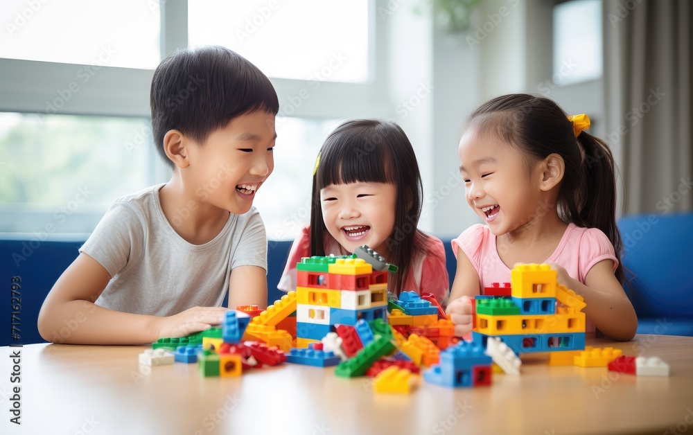 Three Young Children Engaged in Creative Play With Colorful Building Blocks Indoors Three Young Children Engaged in Creative Play With Colorful Building Blocks Indoors