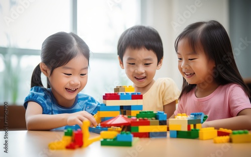 Three Young Children Engaged in Creative Play With Colorful Building Blocks Indoors